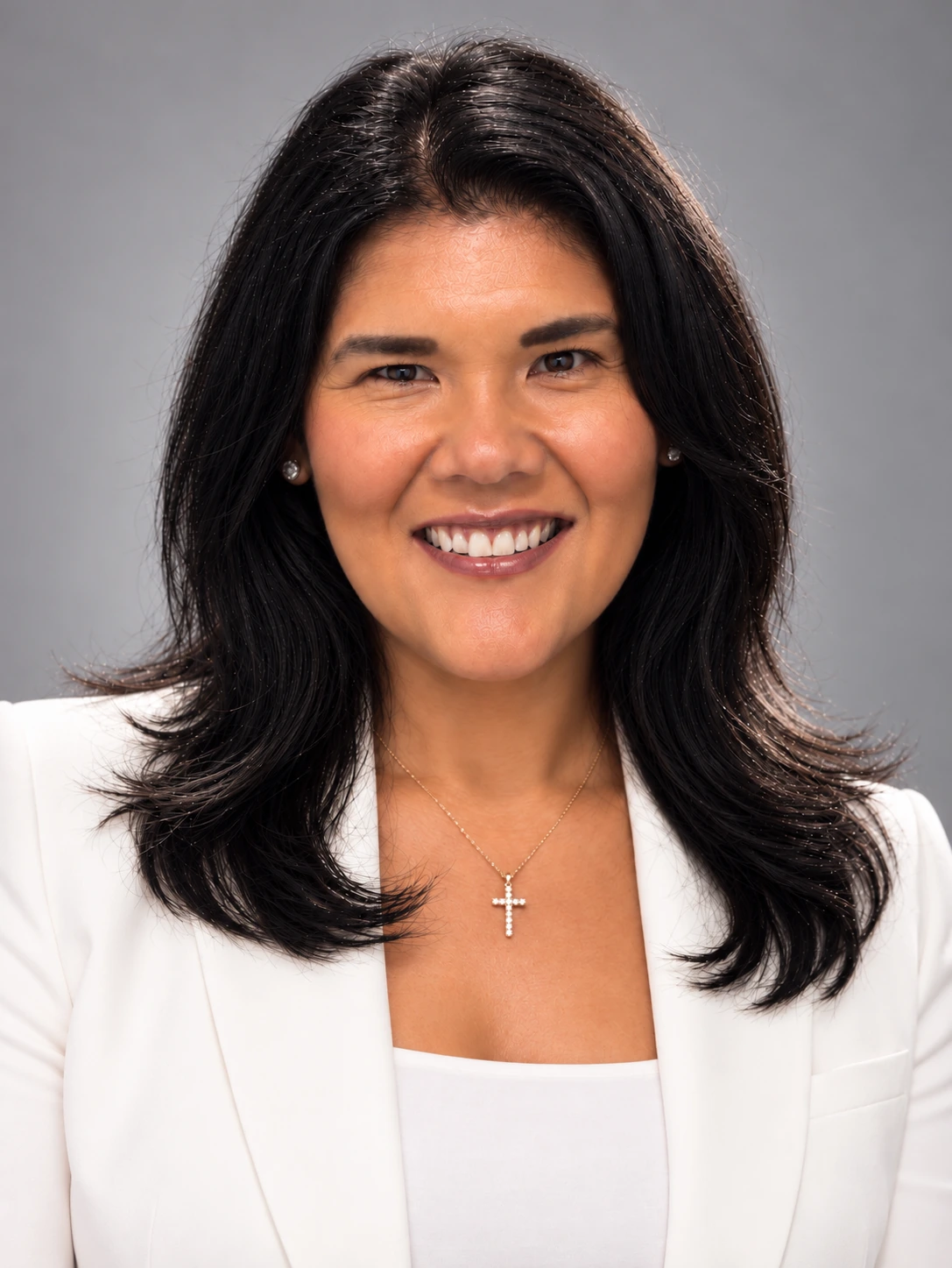 Pauline Roth smiling in a white blazer
